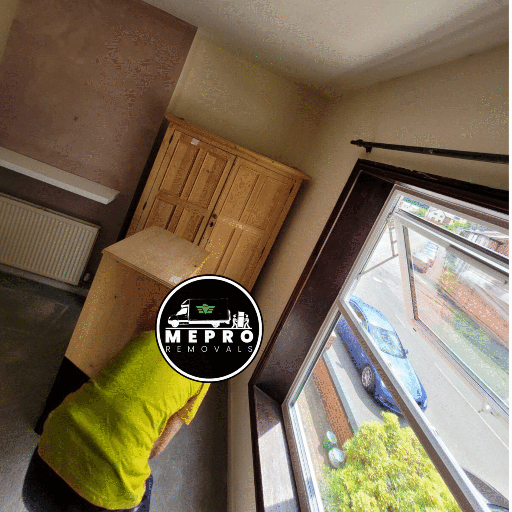 The Mepro Removals team carefully handling furniture during one of their Manchester family removals.