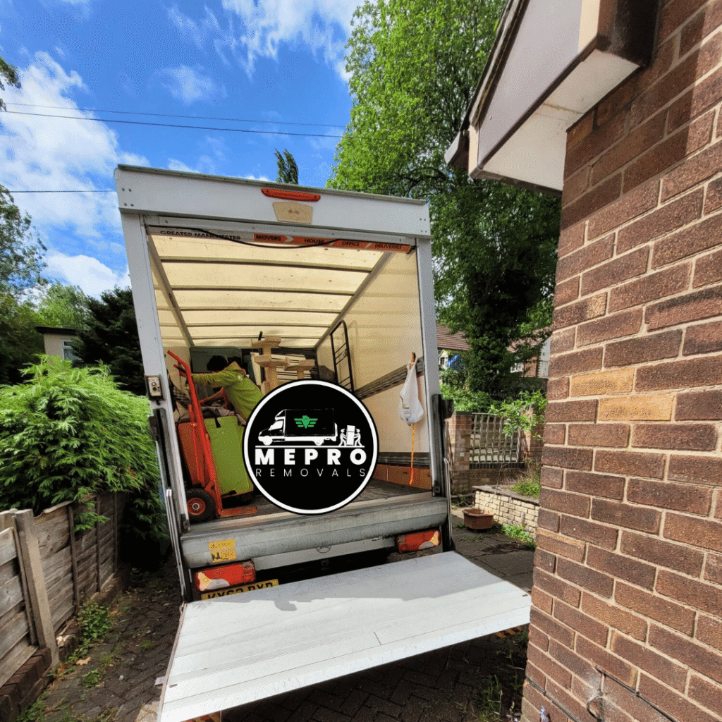 The Mepro Removals team, specialists in Restaurant Removals Manchester, carefully loading commercial kitchen equipment into a va