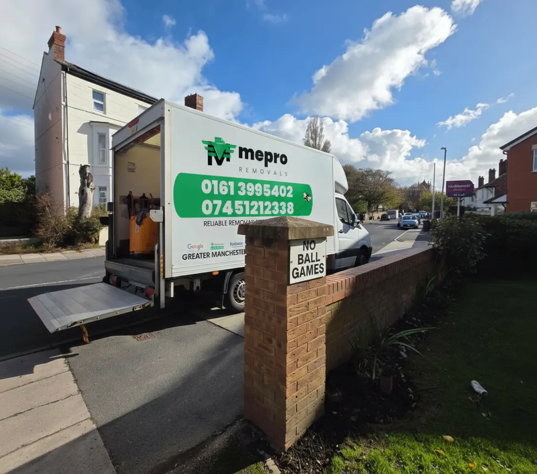 Mepro Removals team expertly maneuvering a heavy new appliance into a Manchester home during November.