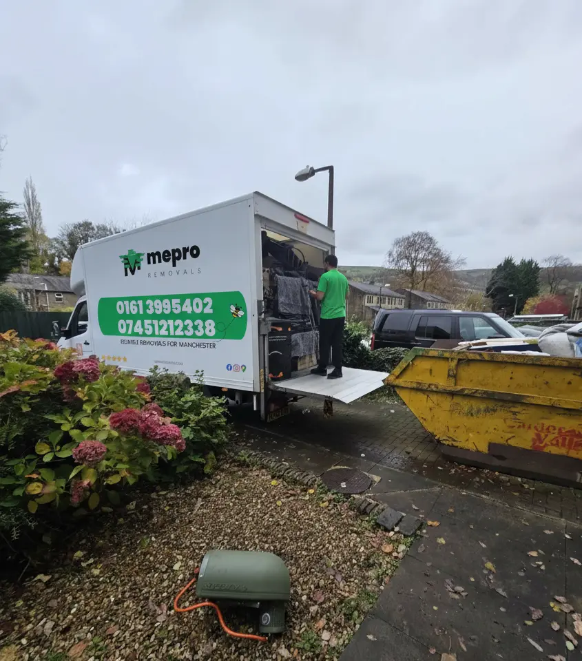 Mepro Removals van parked on a leafy Manchester street during a crisp November house move.